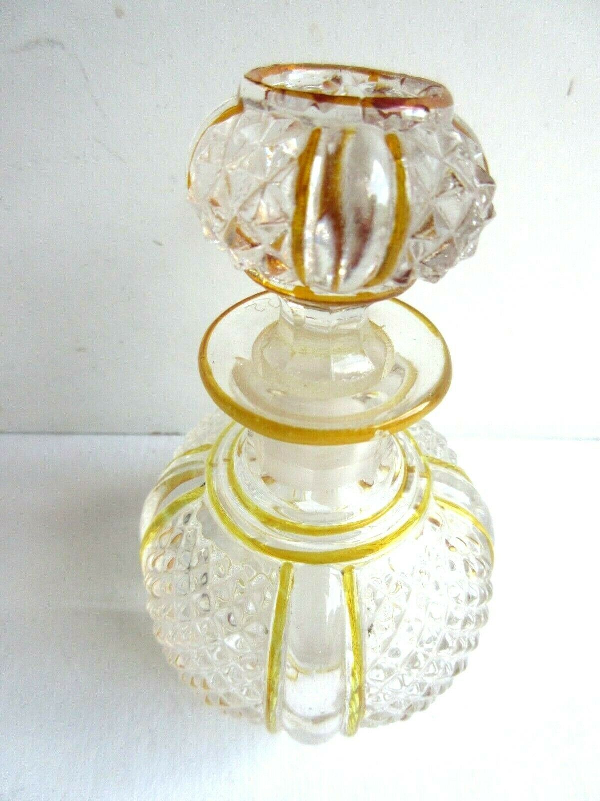Baccarat perfume bottle, yellow eds and diamond tips