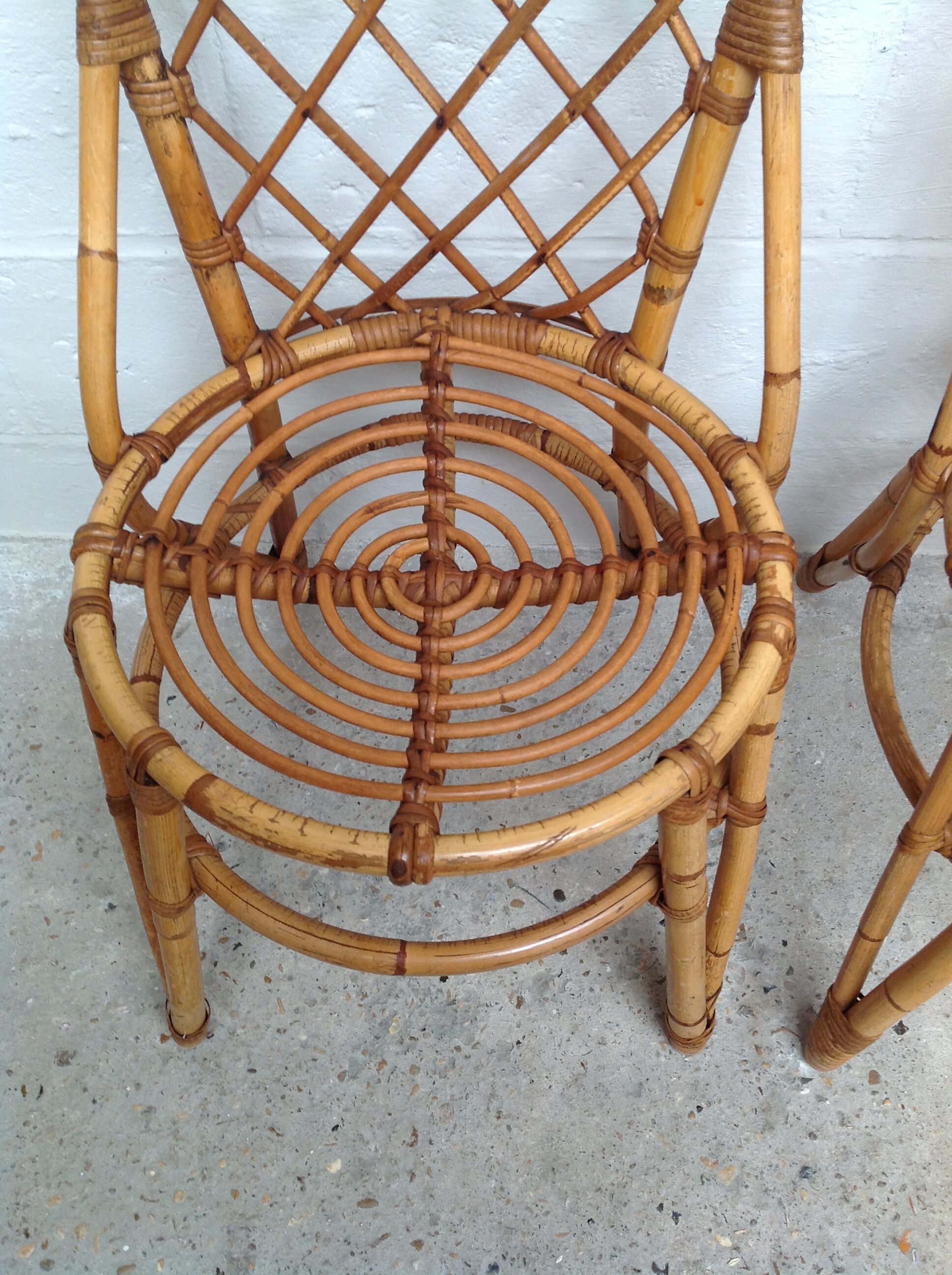 Pair of rattan chairs by Louis Sognot