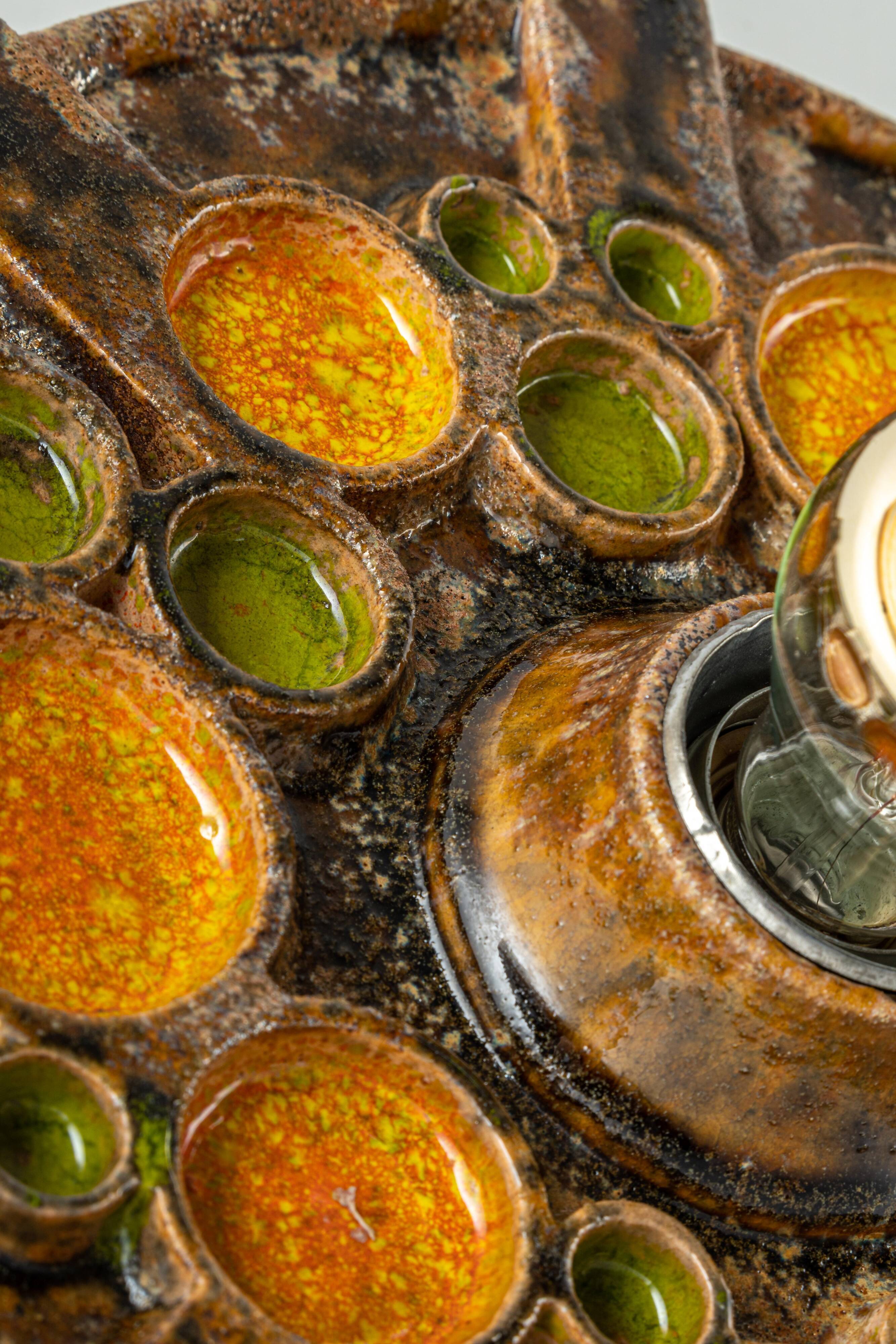 Sputnik wall lamp in brown and orange ceramic, Germany, 1970s.