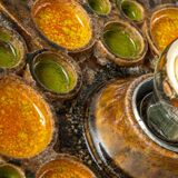Sputnik wall lamp in brown and orange ceramic, Germany, 1970s.