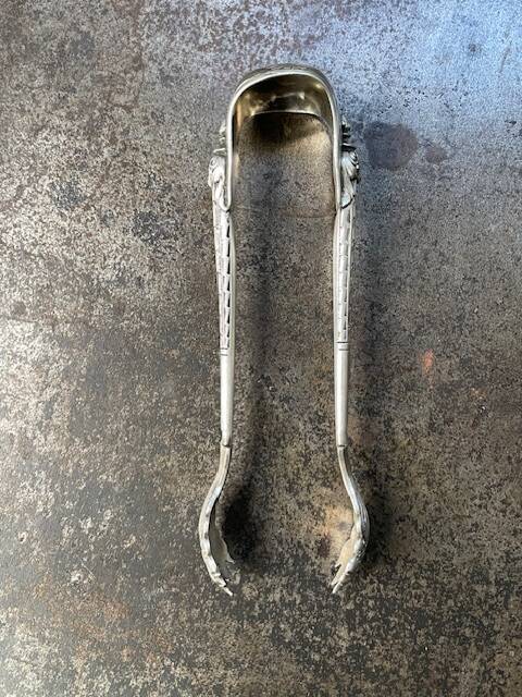 Engraved sugar tongs in solid silver with Minerva hallmark and lion's claws