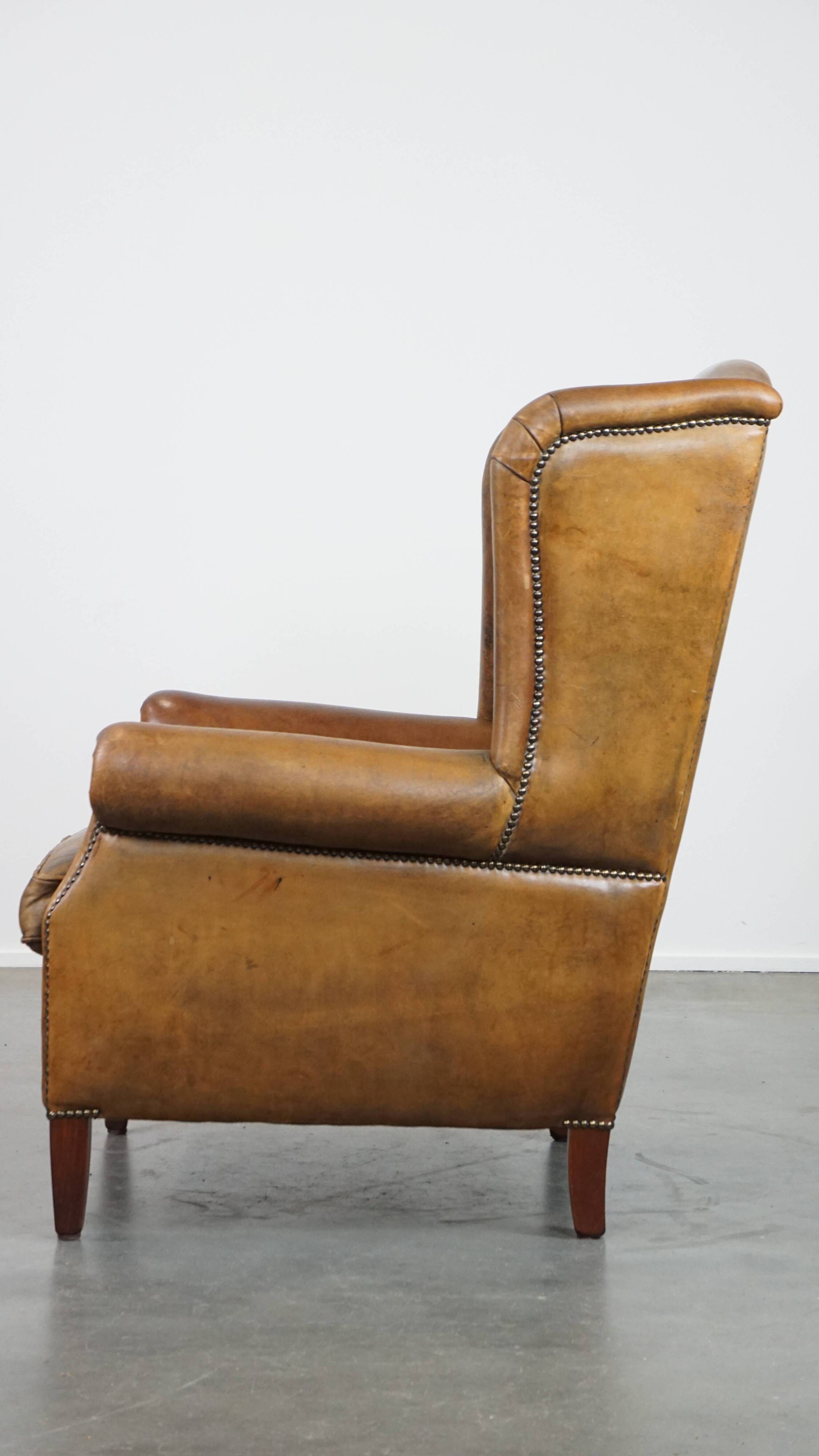 Sheepskin wing chair + XXL patinated footrest