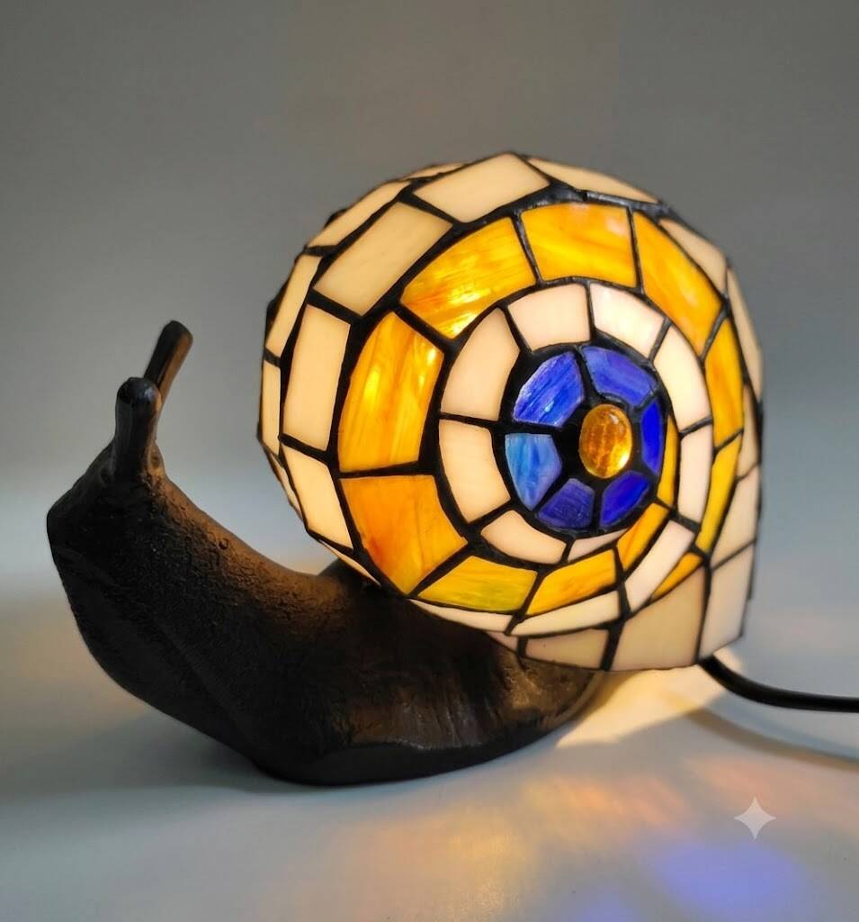 Tiffany-style lamp in the shape of a snail.
