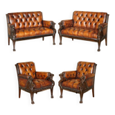Restored leather Chesterfield set with hand-carved lion.