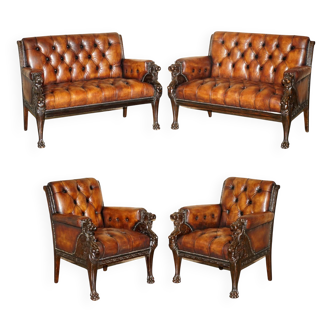Restored leather Chesterfield set with hand-carved lion.