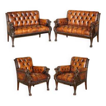 Restored leather Chesterfield set with hand-carved lion.