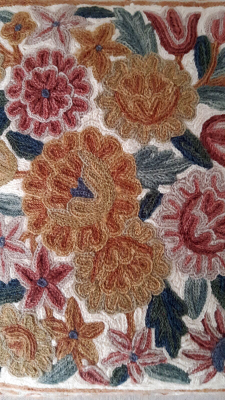 Set of three old hand-embroidered wool cushions