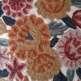 Set of three old hand-embroidered wool cushions