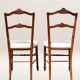 Paire de chaises volantes avec assise tapissée