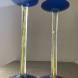 Duo of vintage Kosta Boda candlesticks in glass paste