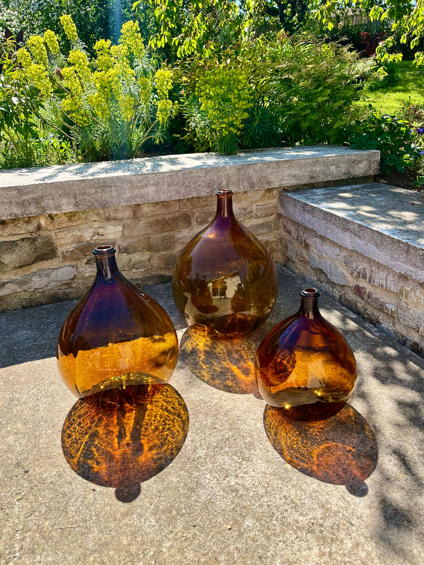 Lot de 3 dame-jeanne ambrées
