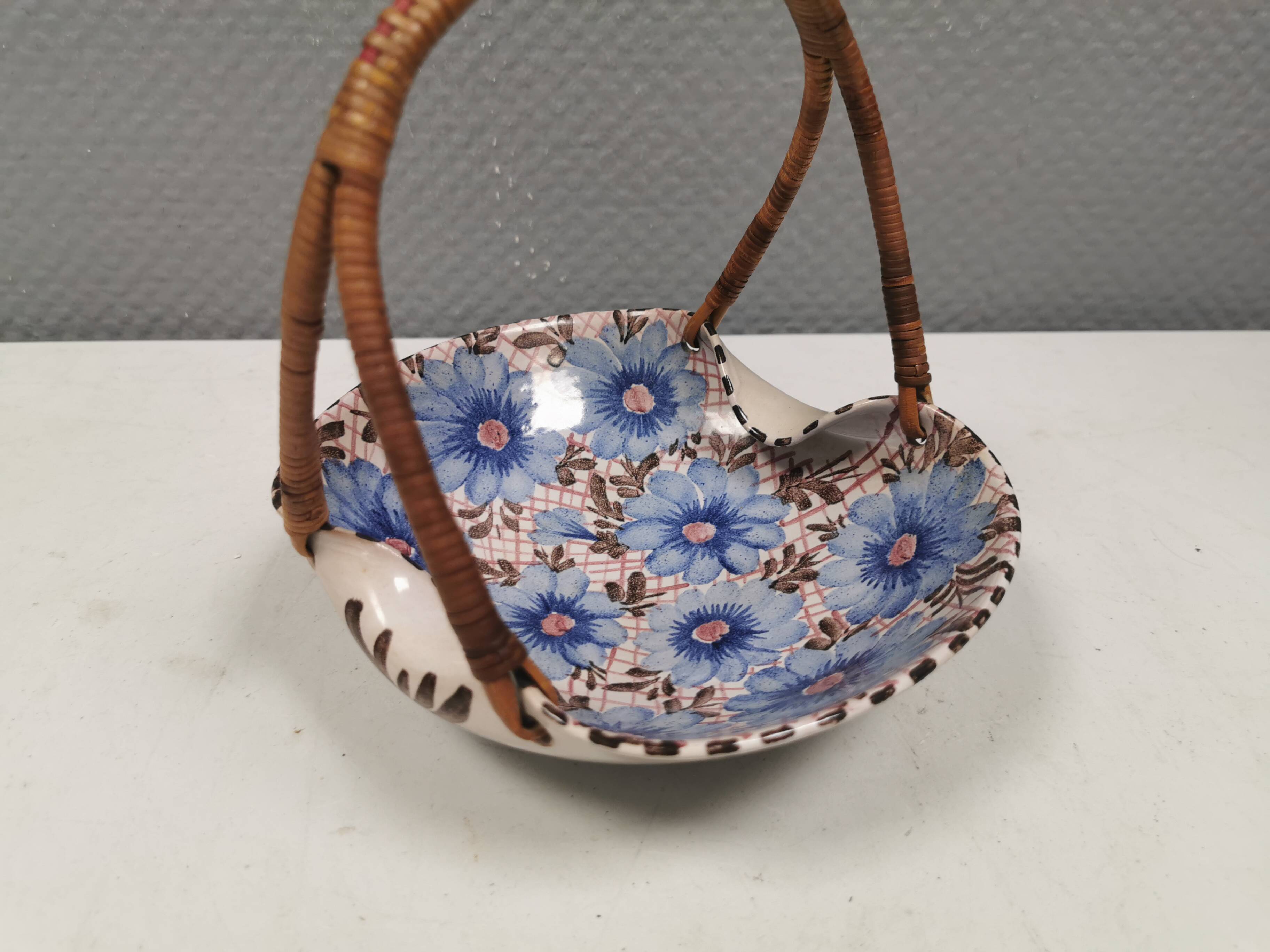 Beautiful small painted ceramic basket with woven handle