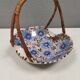 Beautiful small painted ceramic basket with woven handle