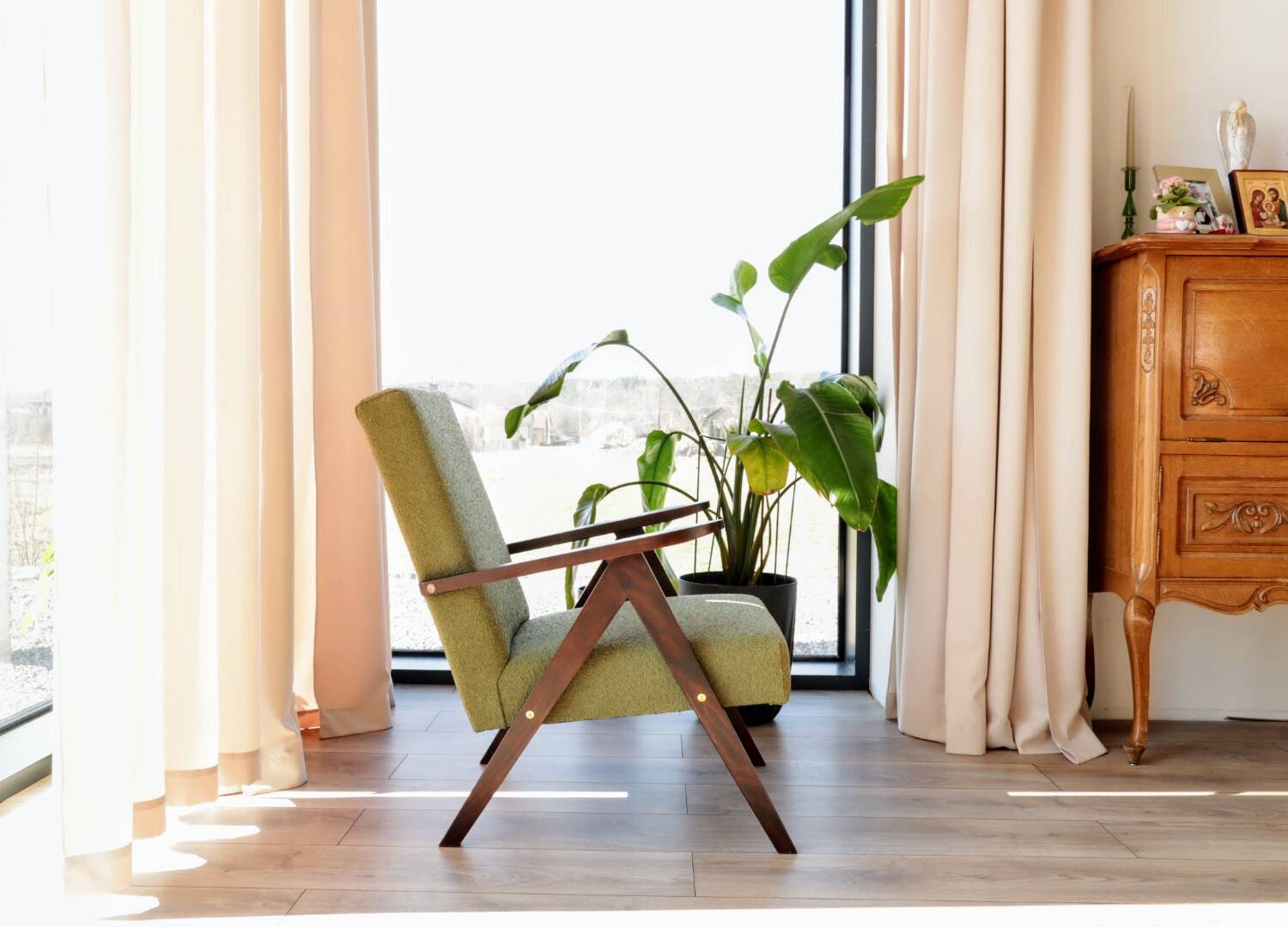 Vintage armchair in moss green bouclé design by H. Lis.