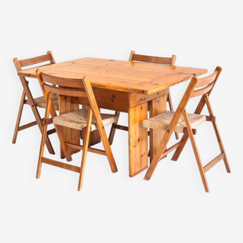 Table and 4 folding chairs in pine and beech wood. Rationalist conception. Vintage. France, 70's