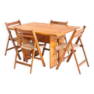 Table and 4 folding chairs in pine and beech wood. Rationalist conception. Vintage. France, 70's