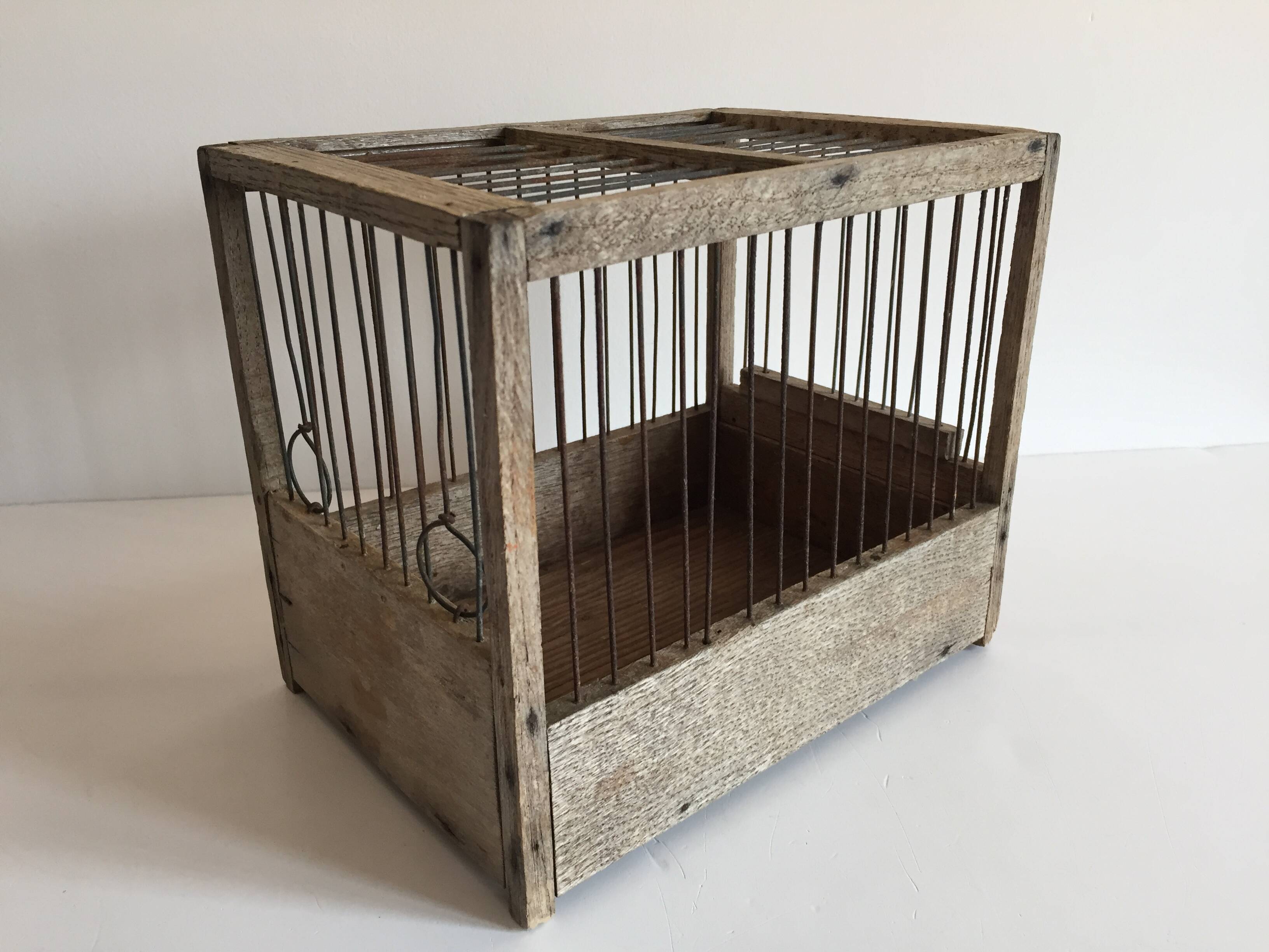 Old bird cage in wood and steel