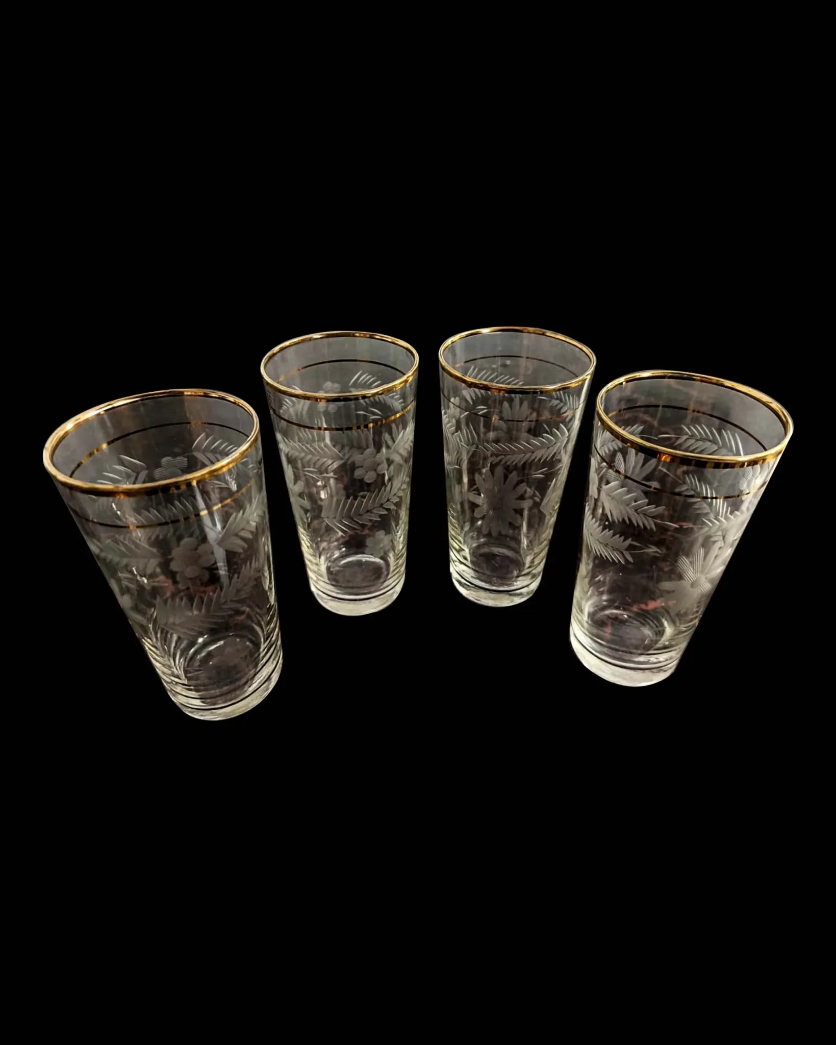 Four engraved crystal glasses from La Granja, with gilded edges, early 20th century.