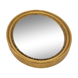 Small old oval mirror in gilded wood
