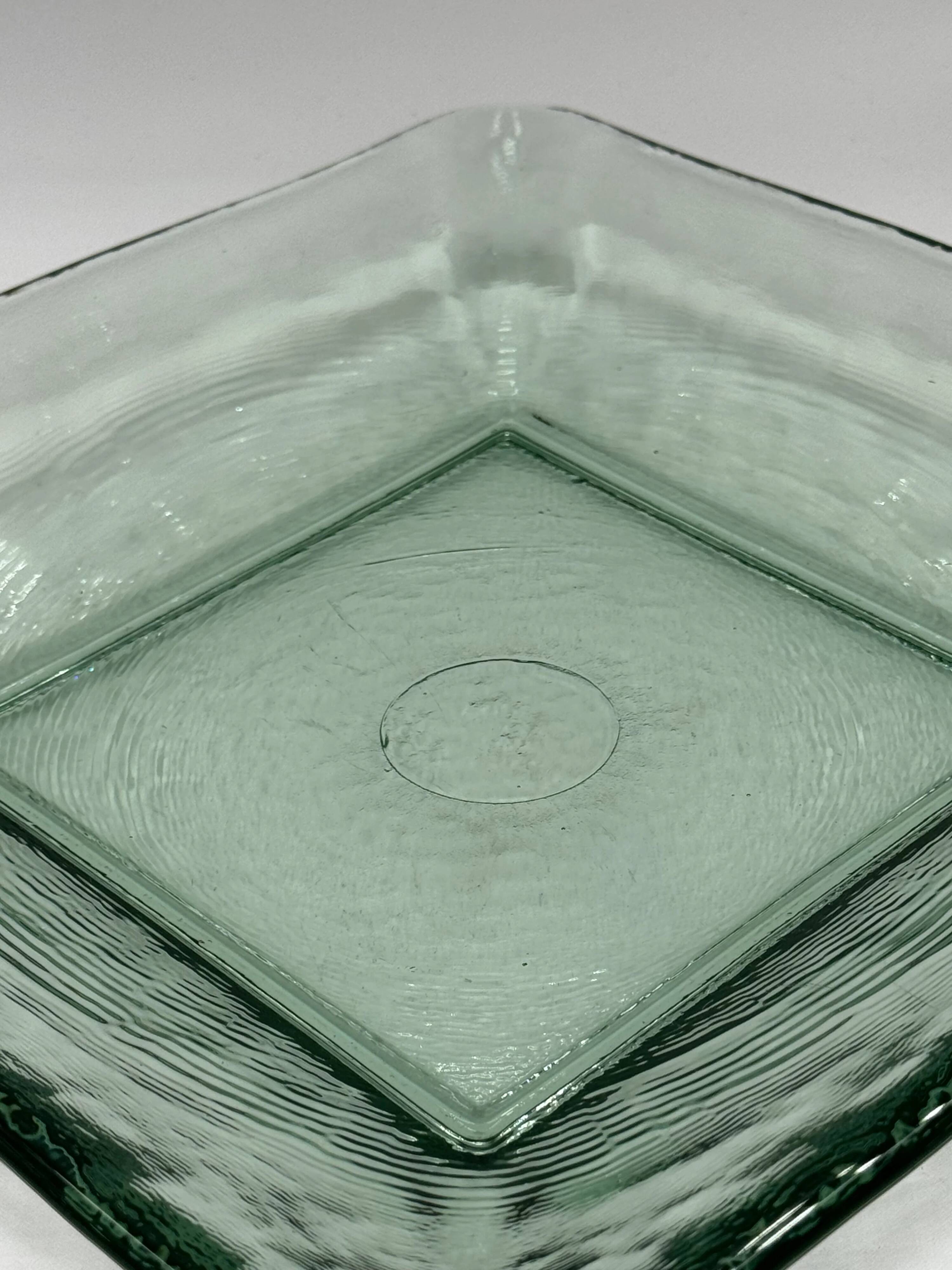 Square sculptural glass plate, textured wavy finish.