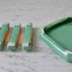 Set of a bottle bottom and 5 knife holders in art deco mint green ceramic