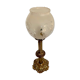 Ancient lamp on foot