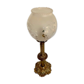 Ancient lamp on foot