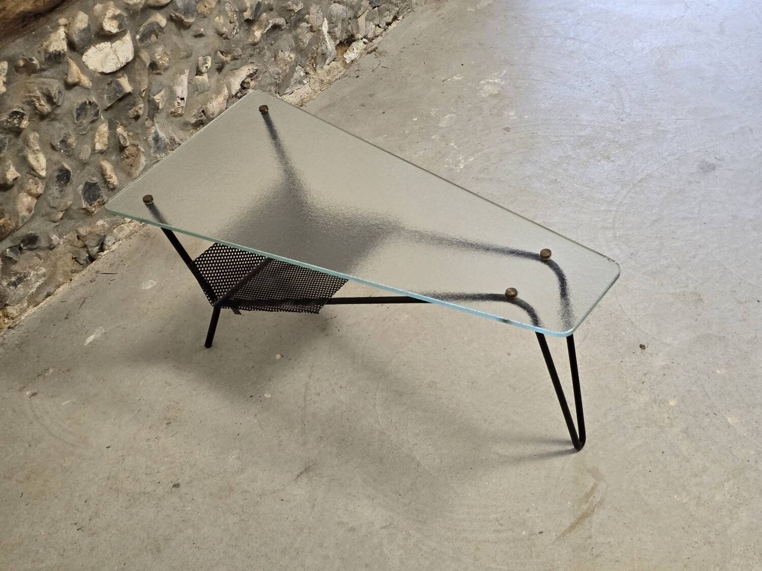Coffee table in glass and black lacquered metal
