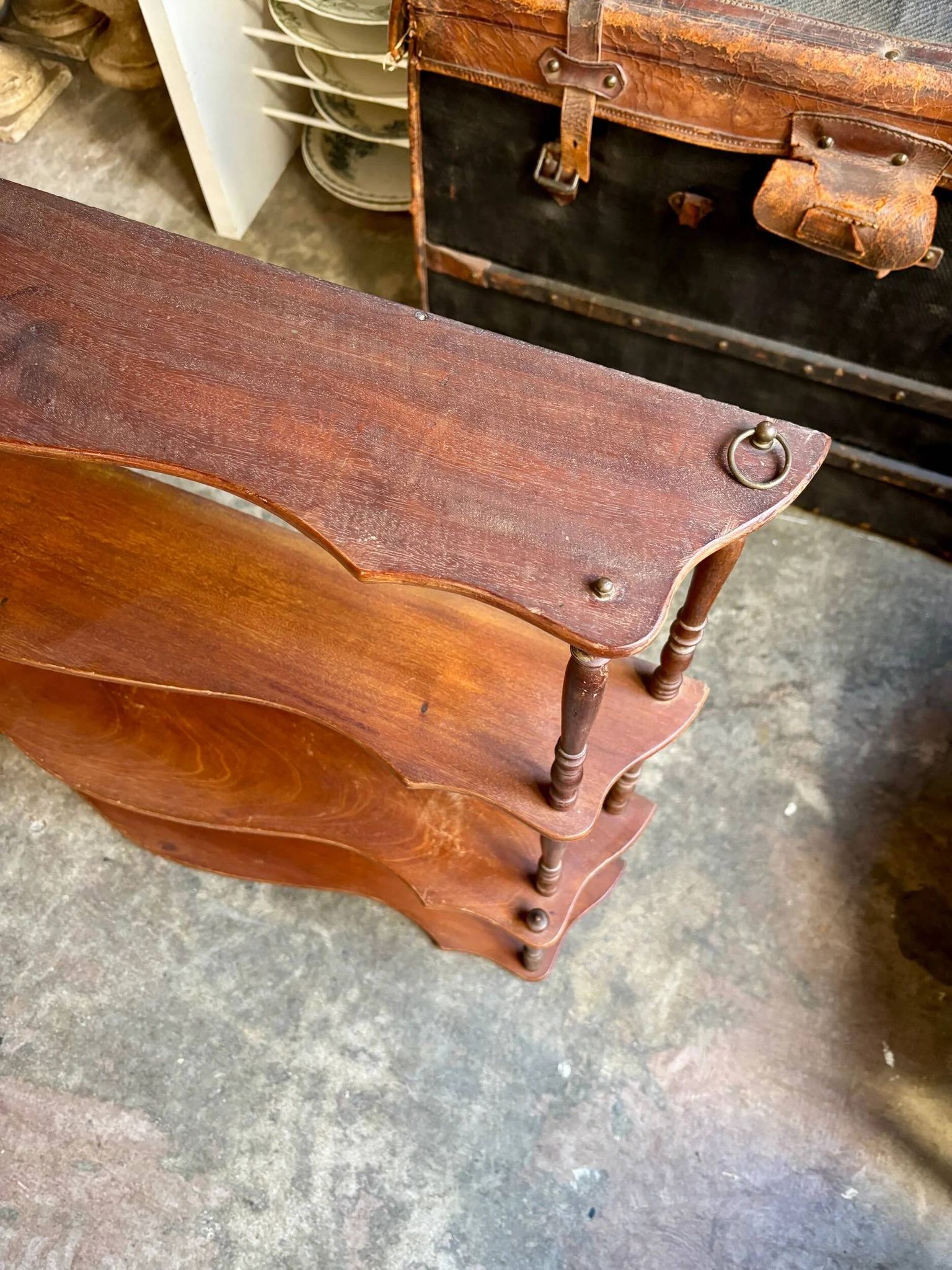 Curved and turned wooden wall shelf