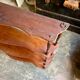 Curved and turned wooden wall shelf