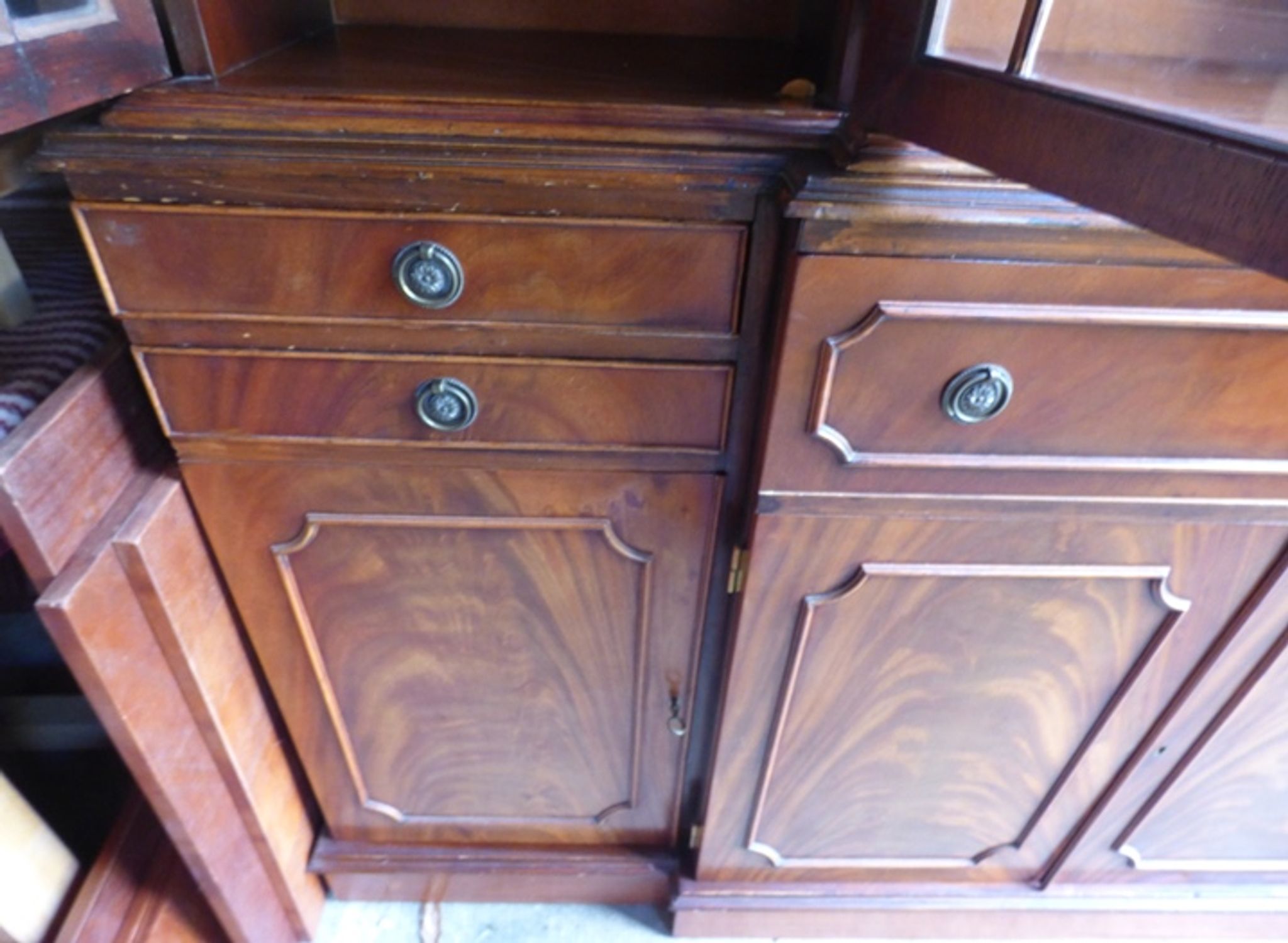 Scribanne bookcase in mahogany veneer English work of the twentieth century