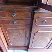 Scribanne bookcase in mahogany veneer English work of the twentieth century