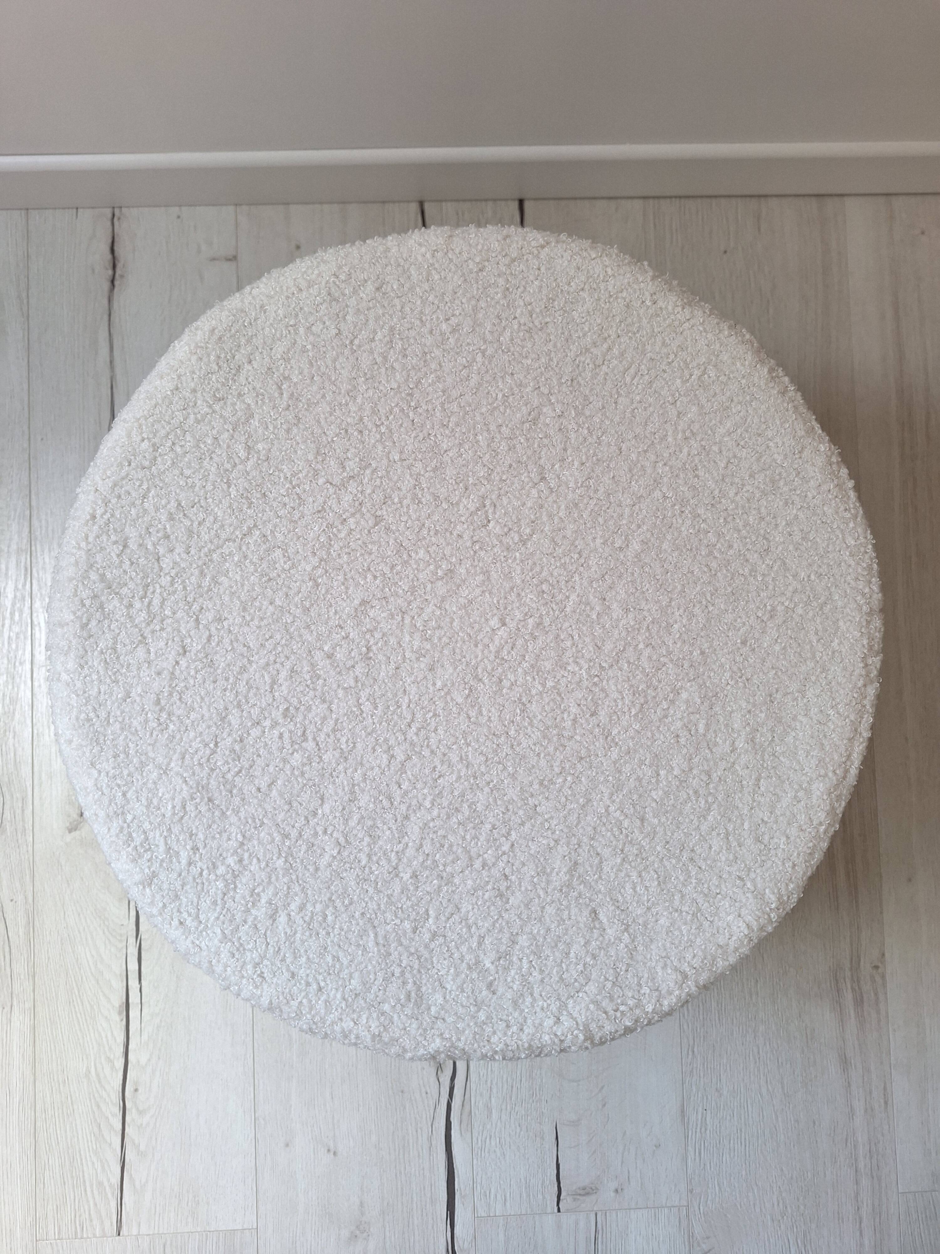 Rattan and boucle fabric pouf