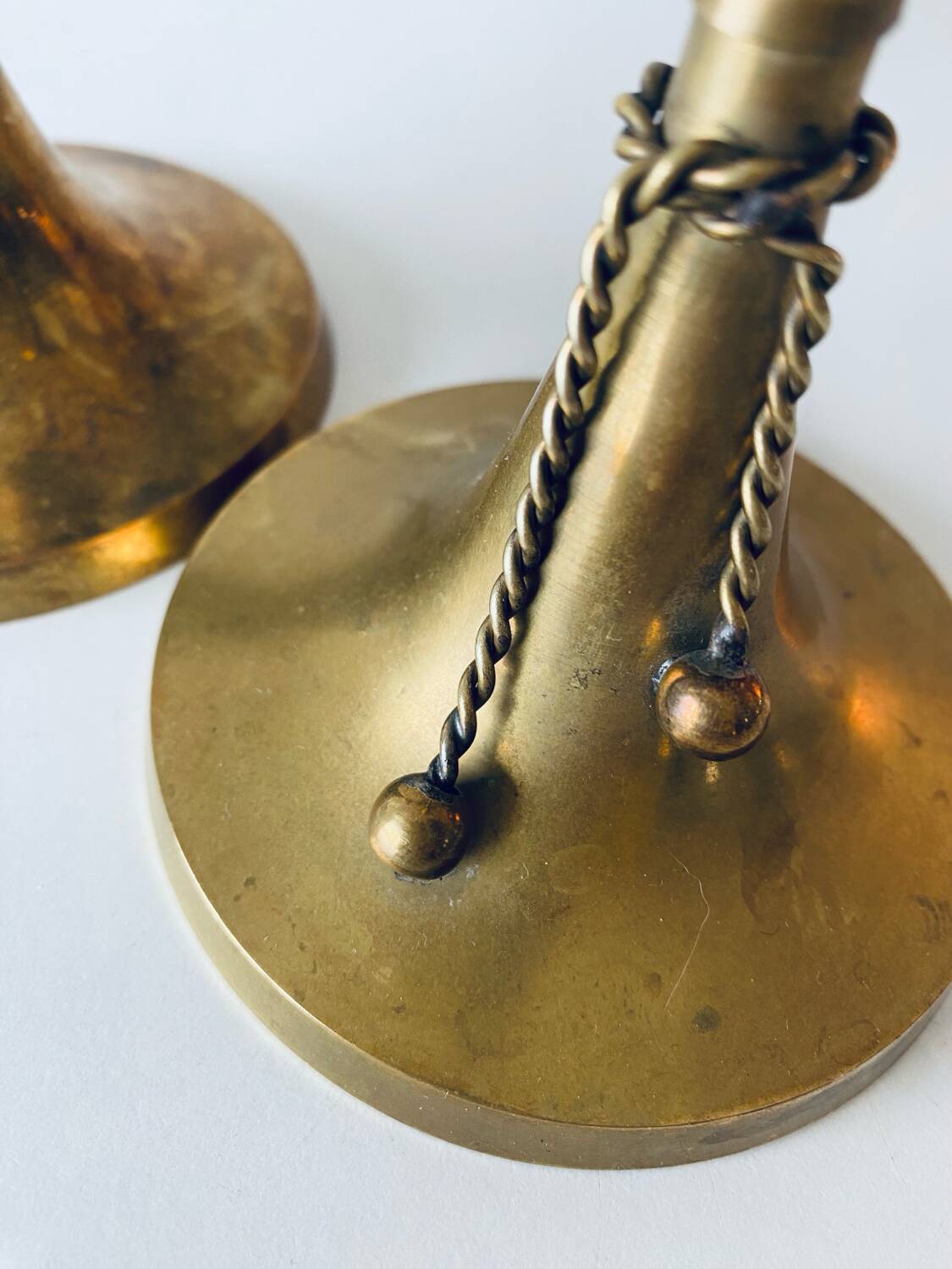 Pair of brass cord candle holders