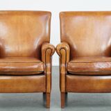 Ensemble de 2 fauteuils en cuir de mouton avec finition passepoil noir