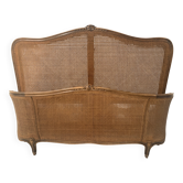 Lit corbeille a fond de canne de style Louis XV en hetre teinté XX siècle+