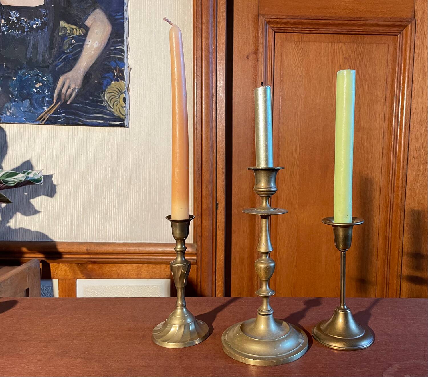 Trio of brass candlesticks