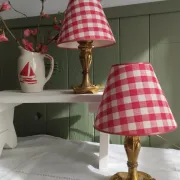 Pair of small lamps in gilded bronze by Petitot and red gingham lampshades.