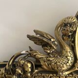 Napoleon III mirror with a pediment featuring black and gold dragons and birds.