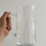 Glass pitcher with decoration of engraved ears of wheat.