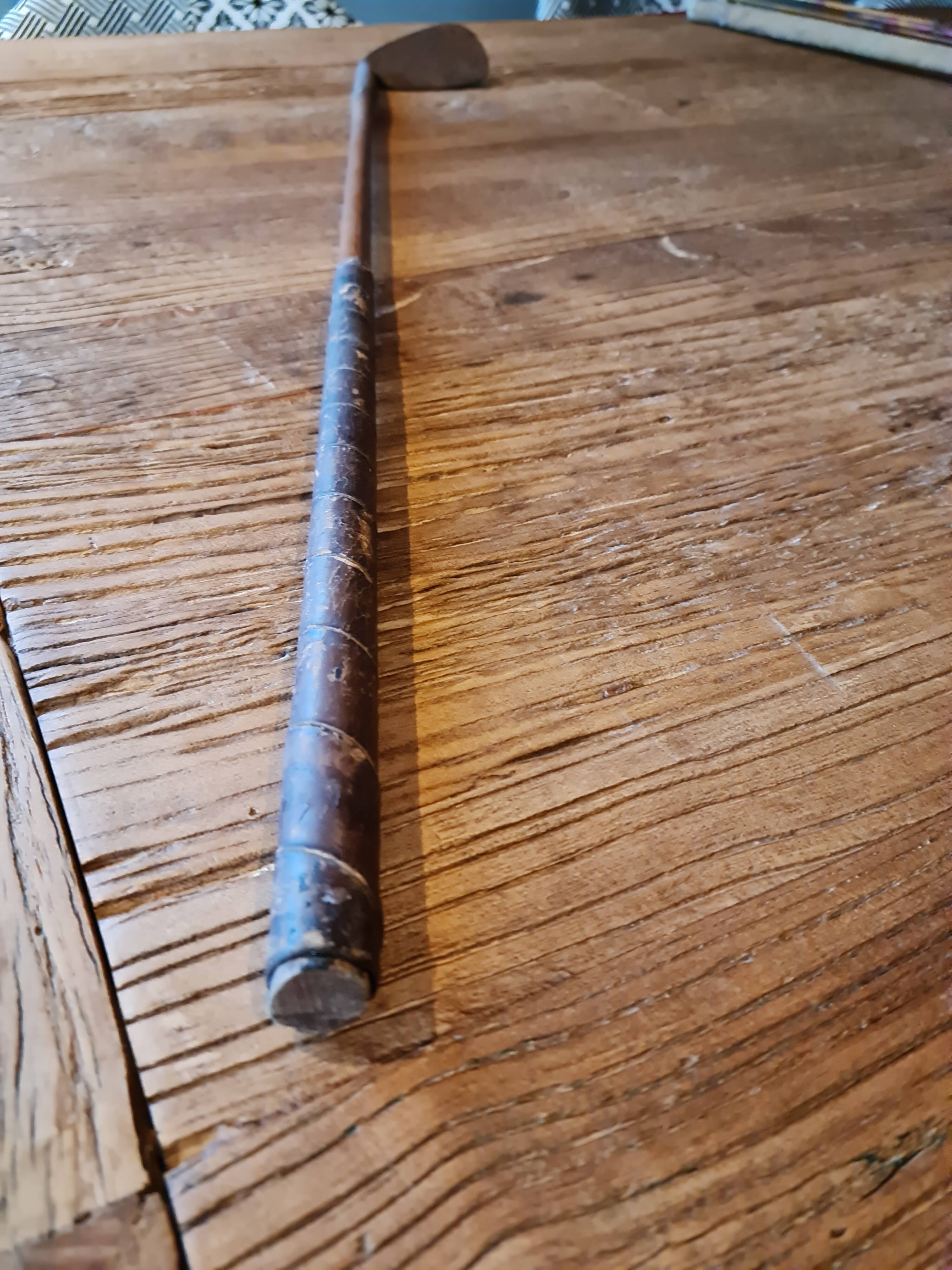Wood, leather and metal golf club