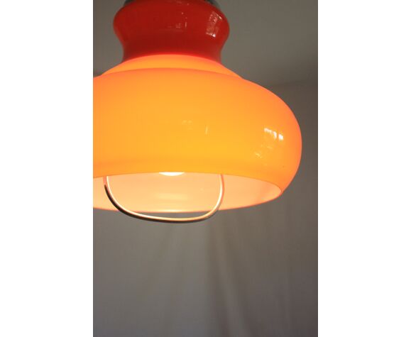 Suspension goes up and down from the kitchen, orange blown glass.
