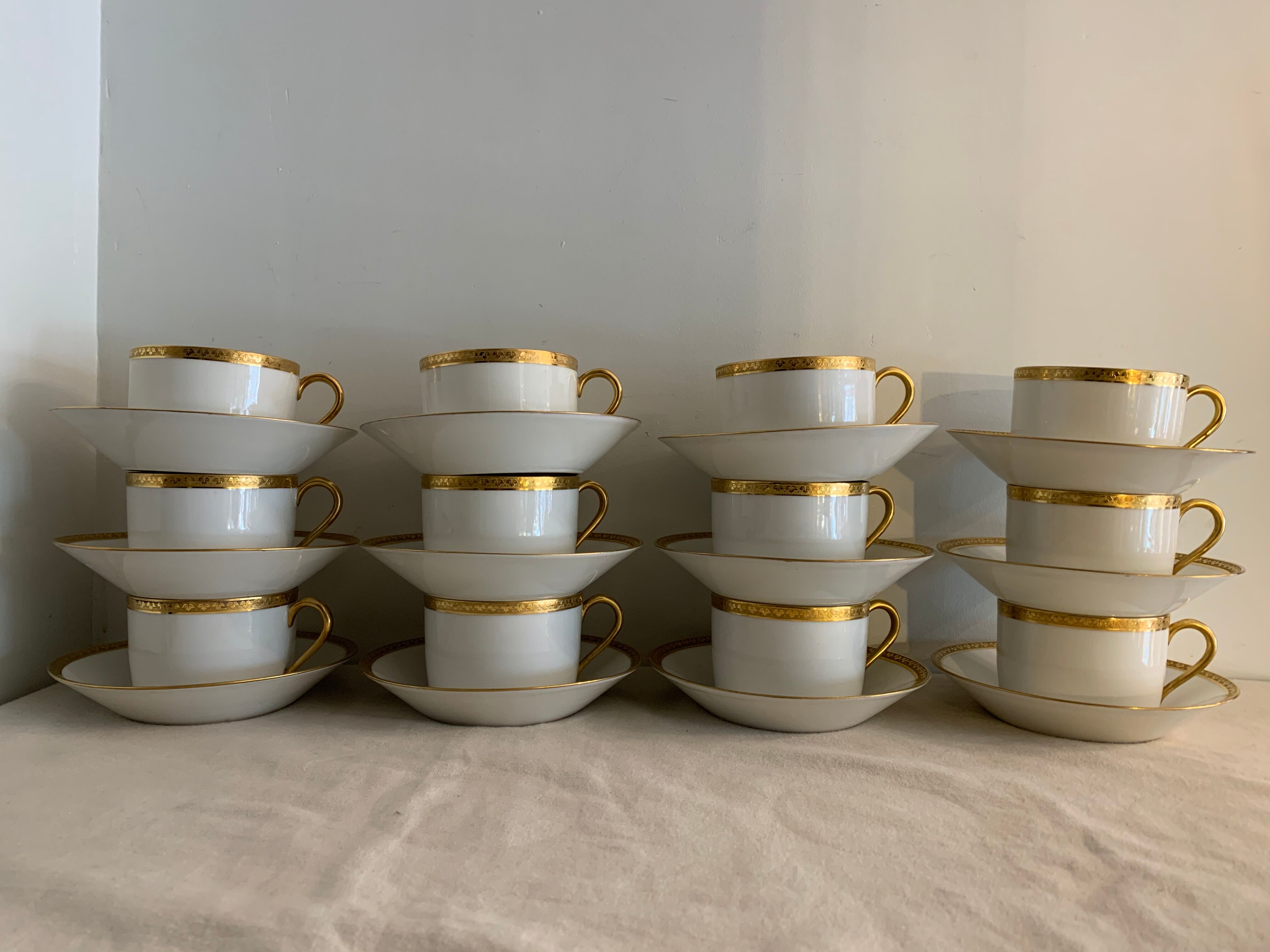 12 coffee cups and 12 white porcelain cups of Gold Gold Limoges