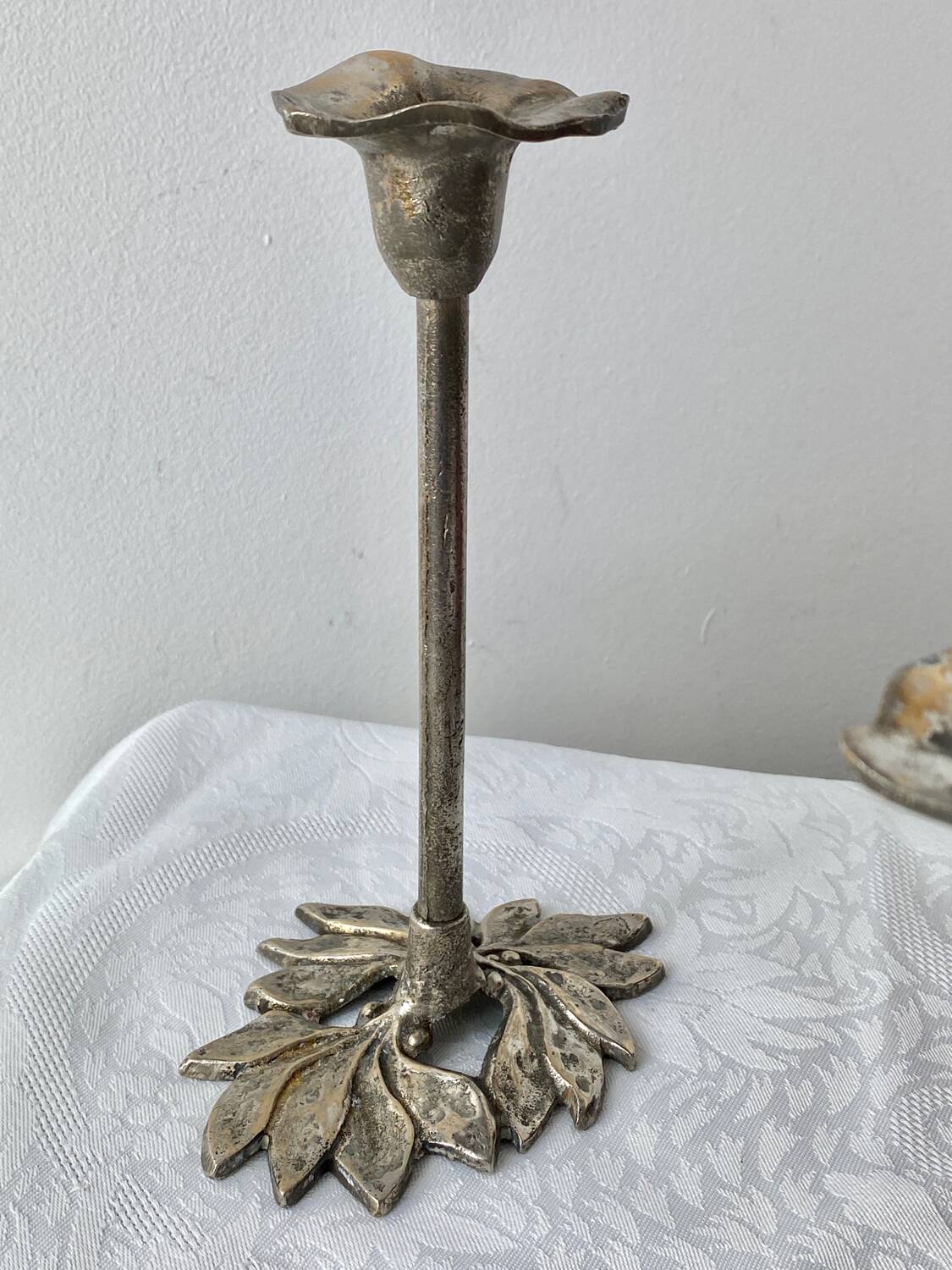 Pair of metal flower candlesticks