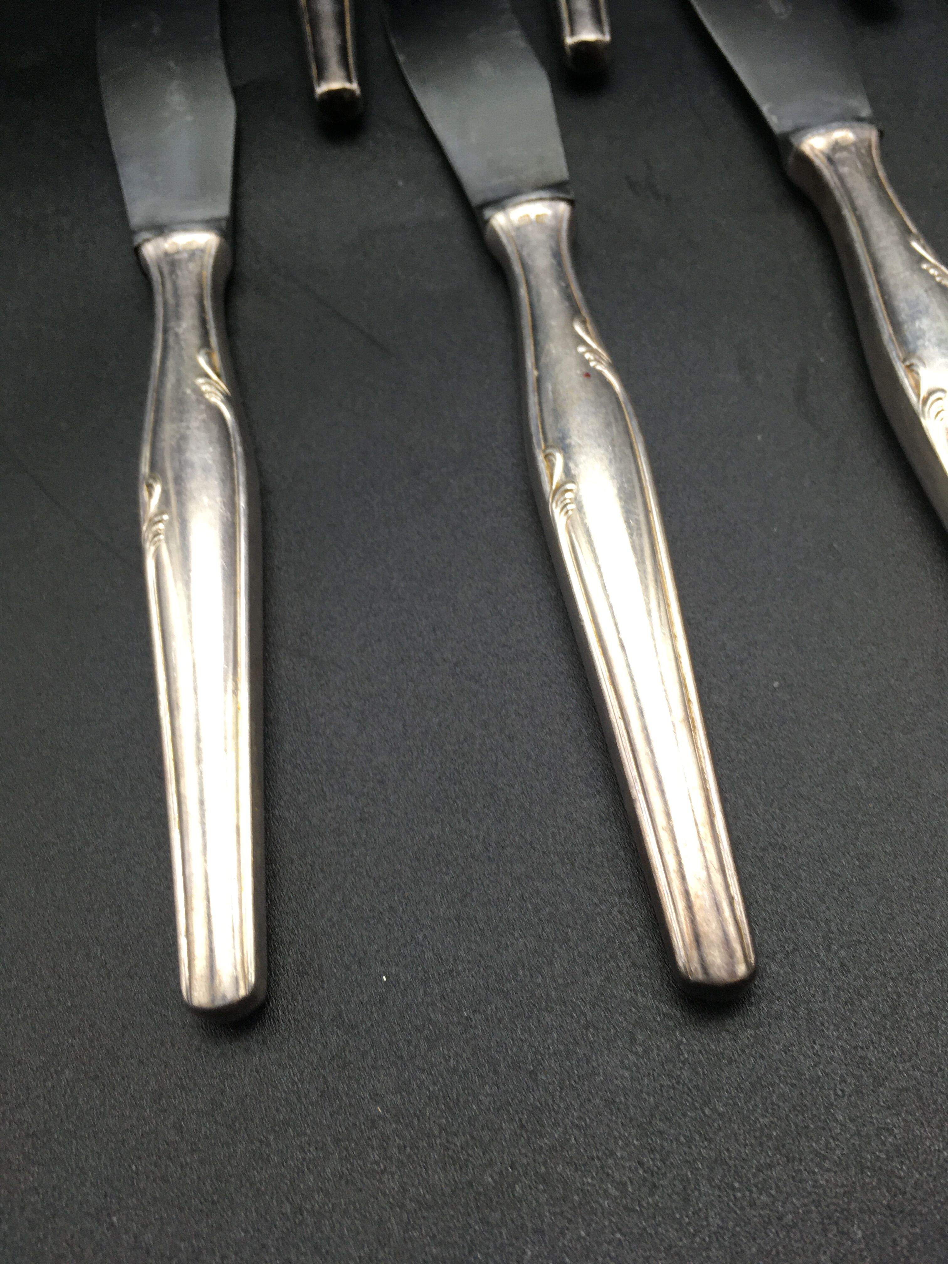 12 silver metal knives