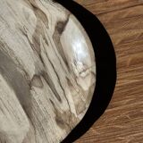 Tray, circular dish or plate made of white striped grey petrified wood.