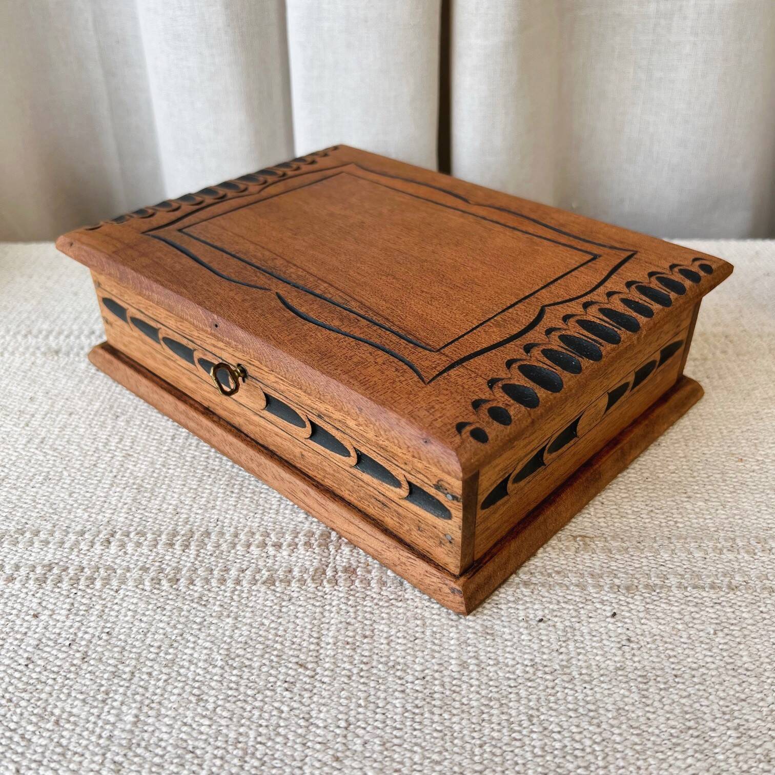 Carved wooden box with key