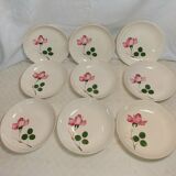 9 hollow plates caps in faience with decor of a rosebud