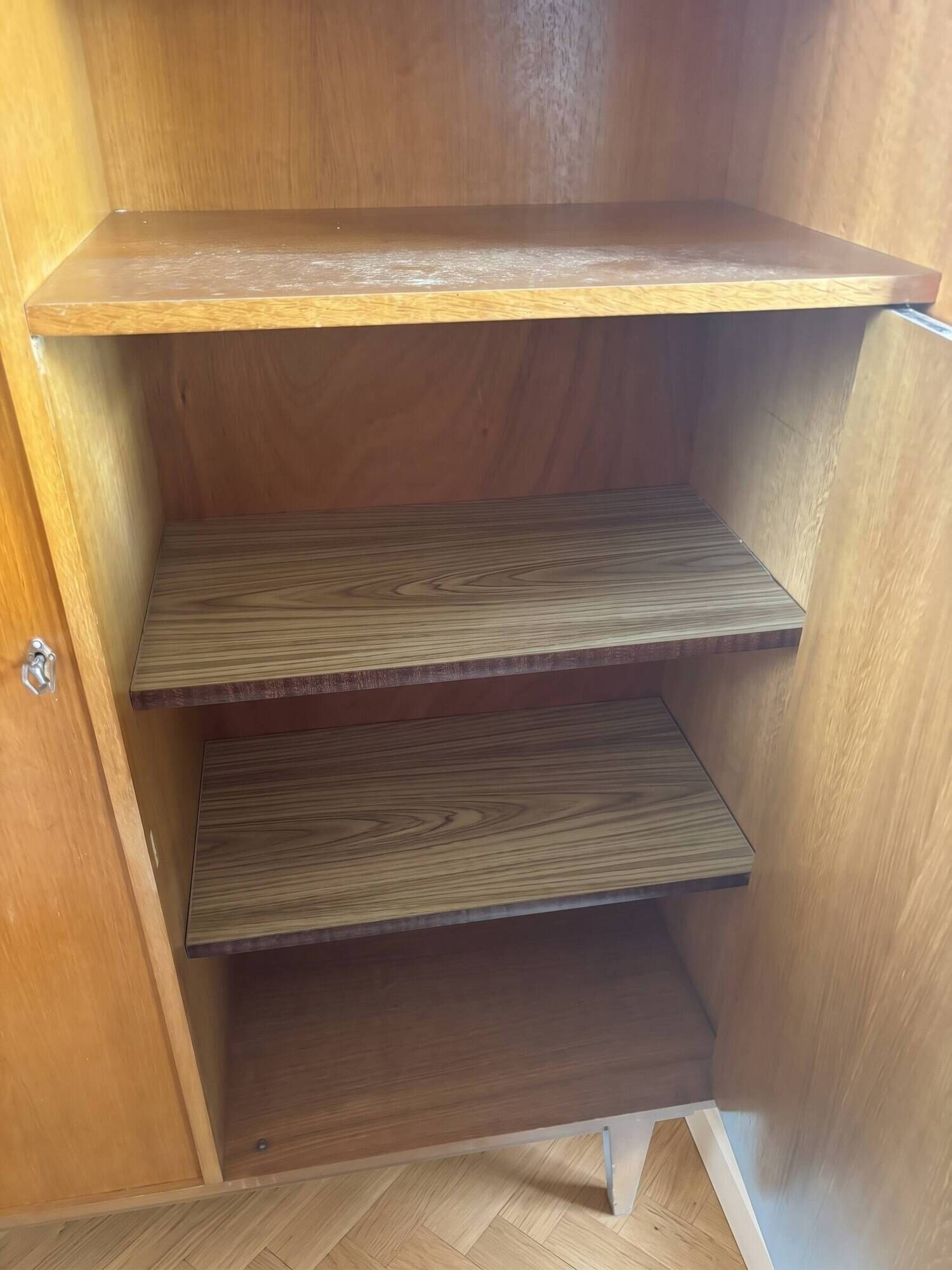 Vintage 1960s wooden wardrobe with tapered legs.