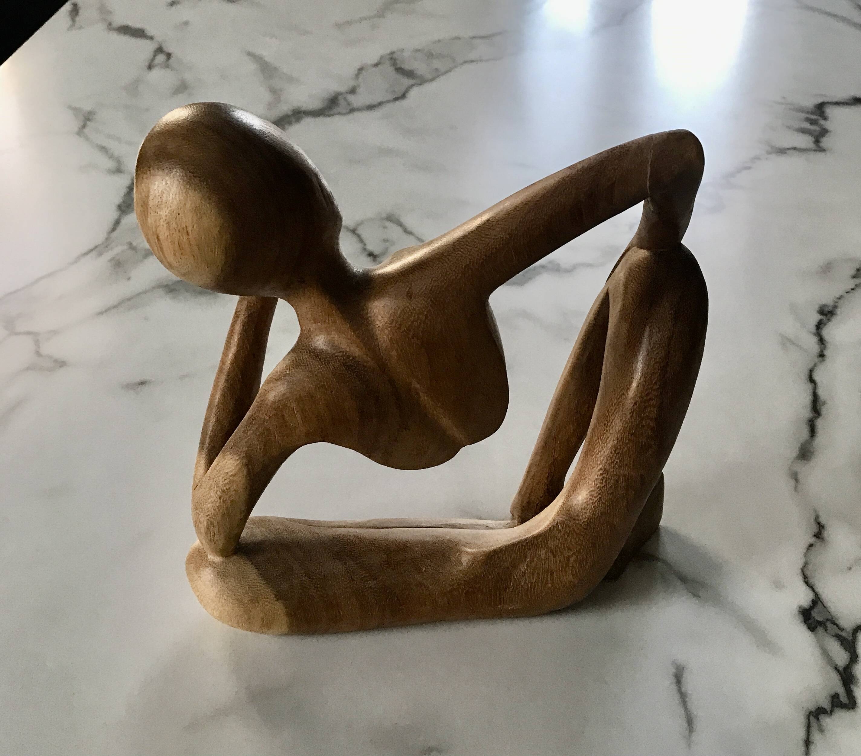 Pensive man wooden statue